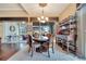 Elegant dining room with hardwood floors, a chandelier, and access to a patio at 12203 Pasha Ln, Orlando, FL 32827