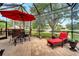 Covered patio with lounge chair and dining table at 12203 Pasha Ln, Orlando, FL 32827