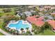 Community pool with unique shape and plenty of lounge chairs at 12203 Pasha Ln, Orlando, FL 32827