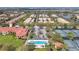 Community tennis courts and pool with surrounding landscape at 12203 Pasha Ln, Orlando, FL 32827