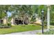 Landscaped backyard with screened patio at 12203 Pasha Ln, Orlando, FL 32827