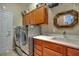 Laundry room with washer, dryer, sink, and cabinets at 12203 Pasha Ln, Orlando, FL 32827