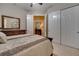 Spacious bedroom with mirrored dresser and large closet at 12203 Pasha Ln, Orlando, FL 32827