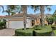 One-story house with a white garage door and brick driveway at 12203 Pasha Ln, Orlando, FL 32827