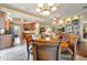 Bright dining area with hardwood floors and a view into the kitchen and living room at 12203 Pasha Ln, Orlando, FL 32827