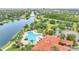 Community pool with surrounding lounge area and landscaping at 12203 Pasha Ln, Orlando, FL 32827