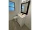 Bright bathroom featuring a toilet, vanity, and updated flooring at 211 Lantana Dr, Orlando, FL 32807