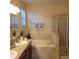 Bathroom with soaking tub and walk-in shower at 2652 Carrickton Cir, Orlando, FL 32824