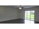 Gathering room with sliding glass doors to backyard at 2652 Carrickton Cir, Orlando, FL 32824