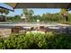 Community pool with lounge chairs and patio tables at 2652 Carrickton Cir, Orlando, FL 32824