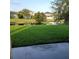 Spacious backyard with pond view and lush green grass at 2652 Carrickton Cir, Orlando, FL 32824
