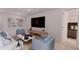 Modern living room with stylish furniture and large TV at 2985 Sw 173Rd Place Rd, Ocala, FL 34473