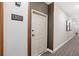 Apartment hallway with modern neutral color scheme at 7573 Laureate Blvd # 1301, Orlando, FL 32827
