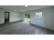 Spacious Gathering room with sliding glass doors to backyard at 4001 Pelican Ln, Orlando, FL 32803