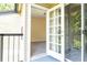 Access to balcony from bedroom with glass door at 1932 Lake Atriums Cir # 86, Orlando, FL 32839