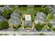 Aerial view of an apartment community with a pool and pond at 1932 Lake Atriums Cir # 86, Orlando, FL 32839
