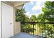 Balcony with view of trees, water, and sky at 1932 Lake Atriums Cir # 86, Orlando, FL 32839