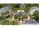 Community pool, clubhouse, and parking lot near a lake at 1932 Lake Atriums Cir # 86, Orlando, FL 32839