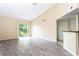 Living room with sliding glass doors and grey tile flooring at 1932 Lake Atriums Cir # 86, Orlando, FL 32839