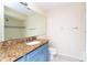 Bathroom featuring granite countertops and tiled shower at 1932 Lake Atriums Cir # 86, Orlando, FL 32839