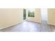 Bedroom with large window and access to balcony at 1932 Lake Atriums Cir # 86, Orlando, FL 32839