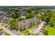 Aerial view of apartment community with pool, lake, and ample parking at 1932 Lake Atriums Cir # 86, Orlando, FL 32839