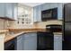 Modern kitchen with granite countertops and stainless steel appliances at 1932 Lake Atriums Cir # 86, Orlando, FL 32839