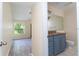 Bathroom with granite countertop and blue vanity at 1932 Lake Atriums Cir # 86, Orlando, FL 32839