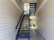 Interior view of a stairwell between two buildings at 1932 Lake Atriums Cir # 86, Orlando, FL 32839