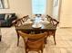 Farmhouse dining table with eight chairs, set for a meal at 8911 Zurich Ln, Kissimmee, FL 34747