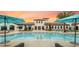 Community resort-style pool with lounge chairs and umbrellas at 8911 Zurich Ln, Kissimmee, FL 34747