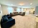 Bonus room with sectional sofa and TV at 8911 Zurich Ln, Kissimmee, FL 34747