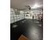 Two-car garage with epoxy floor and storage shelving at 1908 Piedmont Ct, Mascotte, FL 34753