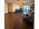 Spacious living area with hardwood floors and sliding doors at 1908 Piedmont Ct, Mascotte, FL 34753