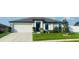 Single-Gathering home with a two-car garage and landscaped yard at 1908 Piedmont Ct, Mascotte, FL 34753