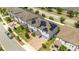 Aerial view of house with solar panels and a paved driveway at 8324 Ludington Cir, Orlando, FL 32836