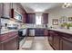 Spacious kitchen featuring granite countertops and island at 16486 Blooming Cherry Dr, Groveland, FL 34736