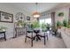 Modern dining area with glass table and seating for four at 16486 Blooming Cherry Dr, Groveland, FL 34736