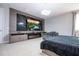 Main bedroom with large bed, electric fireplace, and built-in media console at 8324 Ludington Cir, Orlando, FL 32836