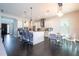 Modern kitchen with island seating and dining area at 8324 Ludington Cir, Orlando, FL 32836
