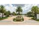 Gated community entrance with lush landscaping at 8324 Ludington Cir, Orlando, FL 32836
