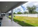 Large backyard with grassy area, offering plenty of space for recreation at 8324 Ludington Cir, Orlando, FL 32836