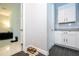 Bright laundry room with white cabinets and granite countertops at 8324 Ludington Cir, Orlando, FL 32836