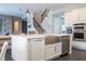 Modern kitchen with stainless steel appliances and large island at 8324 Ludington Cir, Orlando, FL 32836