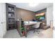 Modern bedroom with built-in desk and wall shelving at 8324 Ludington Cir, Orlando, FL 32836