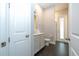 Clean and modern bathroom with grey tile floors and updated vanity at 8324 Ludington Cir, Orlando, FL 32836
