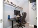 Small home office with a desk, chair, and built in shelving at 8324 Ludington Cir, Orlando, FL 32836