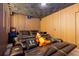 Home theater with black reclining seats and large screen at 8324 Ludington Cir, Orlando, FL 32836