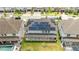 Aerial view of house featuring solar panels, covered patio, and backyard at 8324 Ludington Cir, Orlando, FL 32836