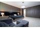 Main bedroom with a king bed, sitting area, and ensuite bathroom access at 8324 Ludington Cir, Orlando, FL 32836